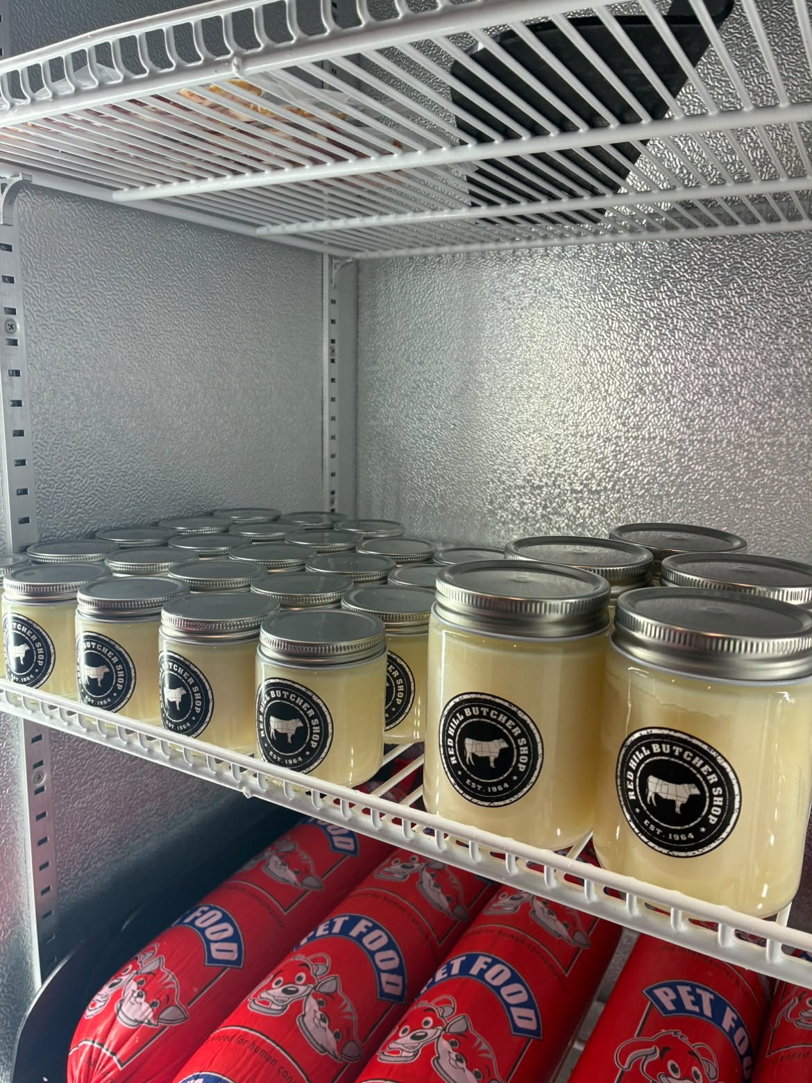 Jars of house-made beef tallow prepared in store